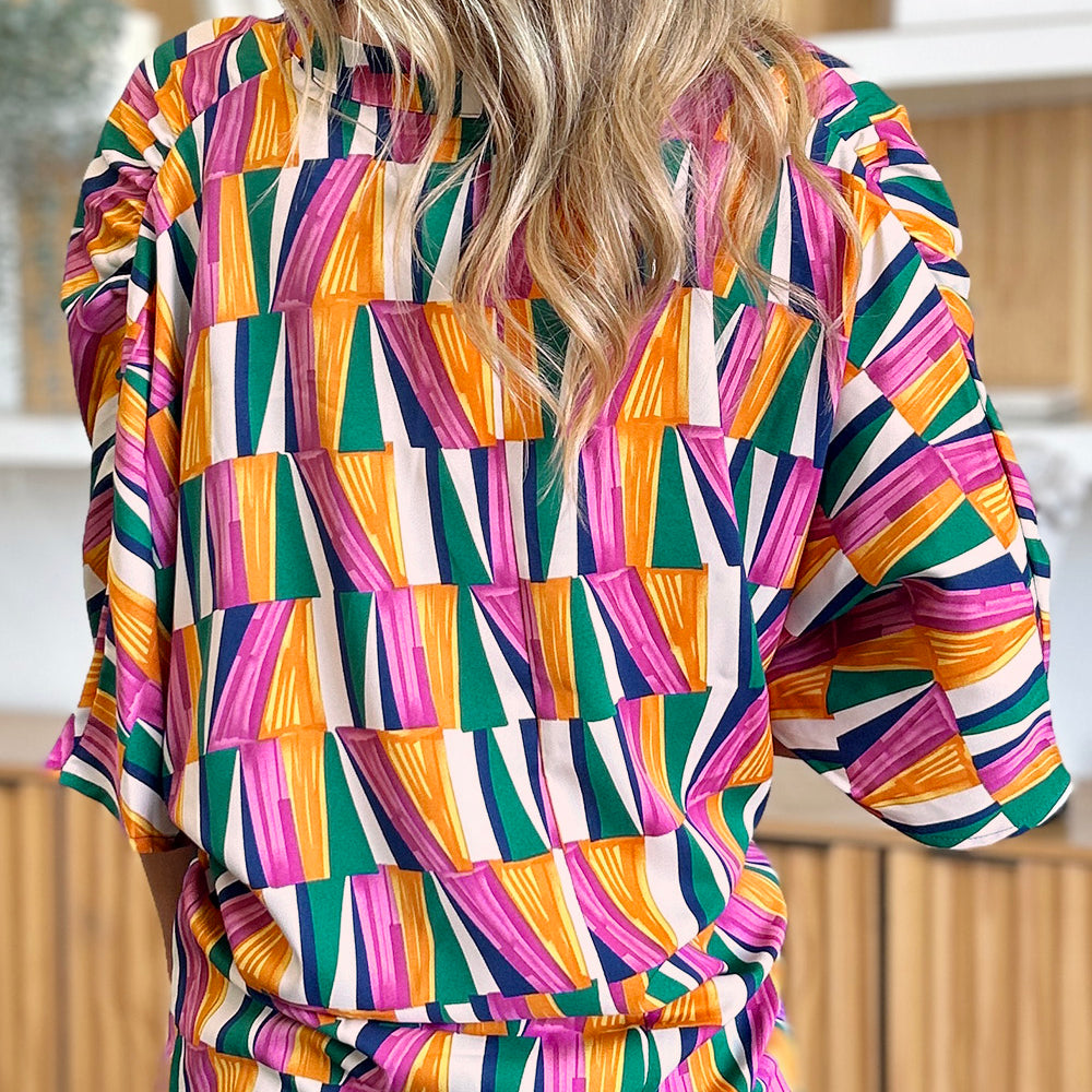 
                      
                        Double Take Full Size Geometric Notched Dolman Sleeve Top
                      
                    