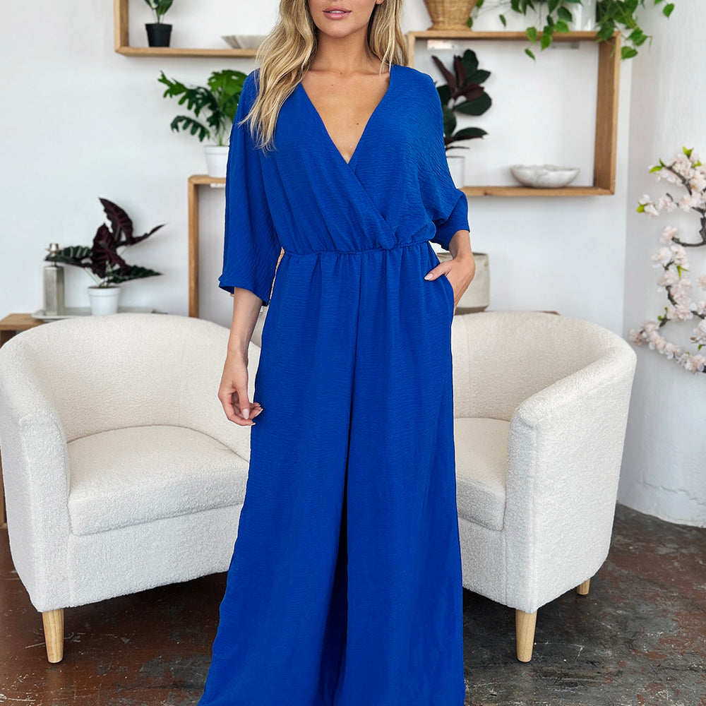 
                      
                        Double Take Full Size Surplice Wide Leg Jumpsuit with Pockets
                      
                    