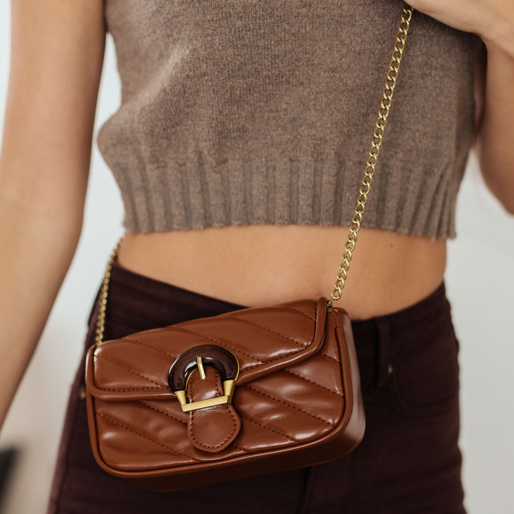 
                      
                        Classic Beauty Quilted Clutch in Brown
                      
                    