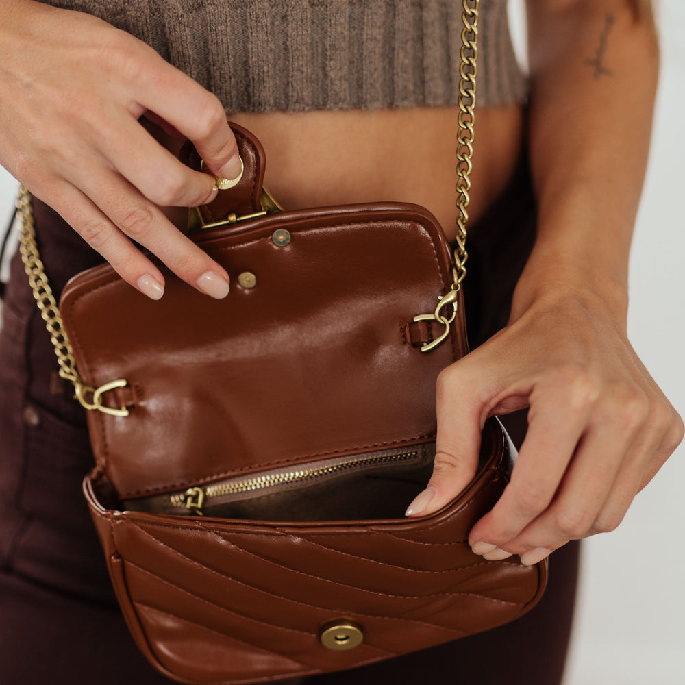 
                      
                        Classic Beauty Quilted Clutch in Brown
                      
                    