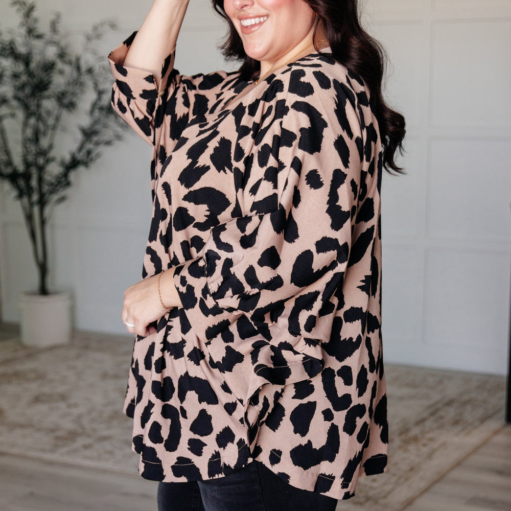 
                      
                        She's Got Eyes of Gold Batwing Blouse
                      
                    