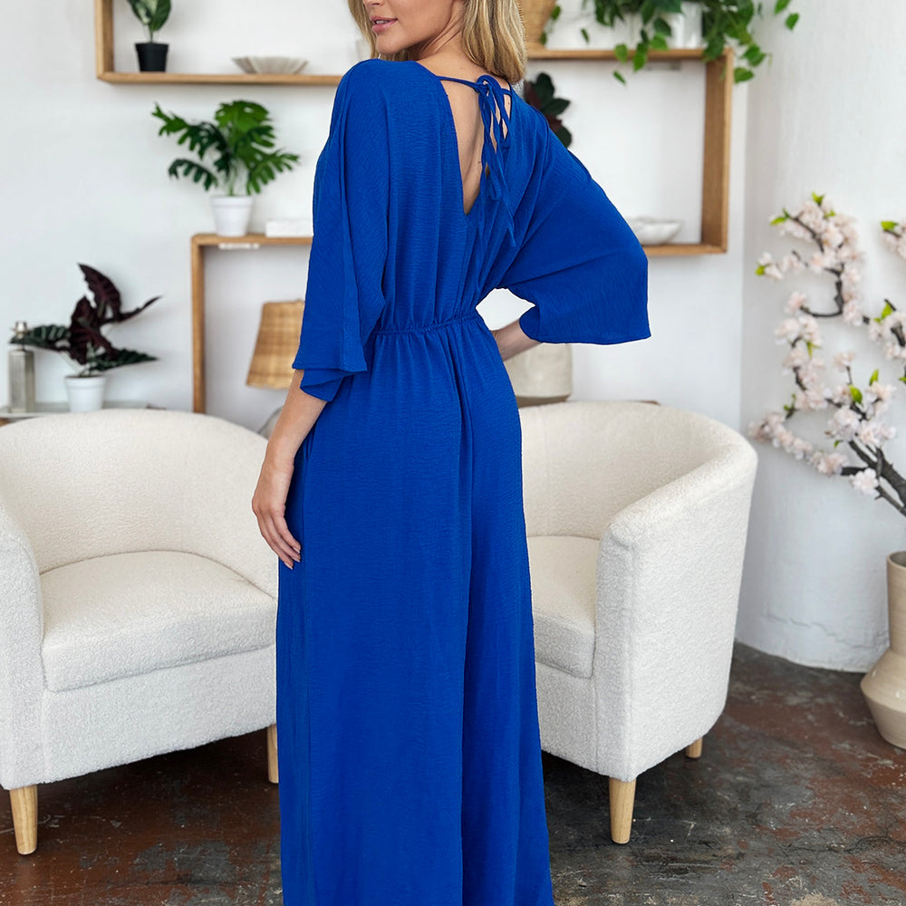 
                      
                        Double Take Full Size Surplice Wide Leg Jumpsuit with Pockets
                      
                    